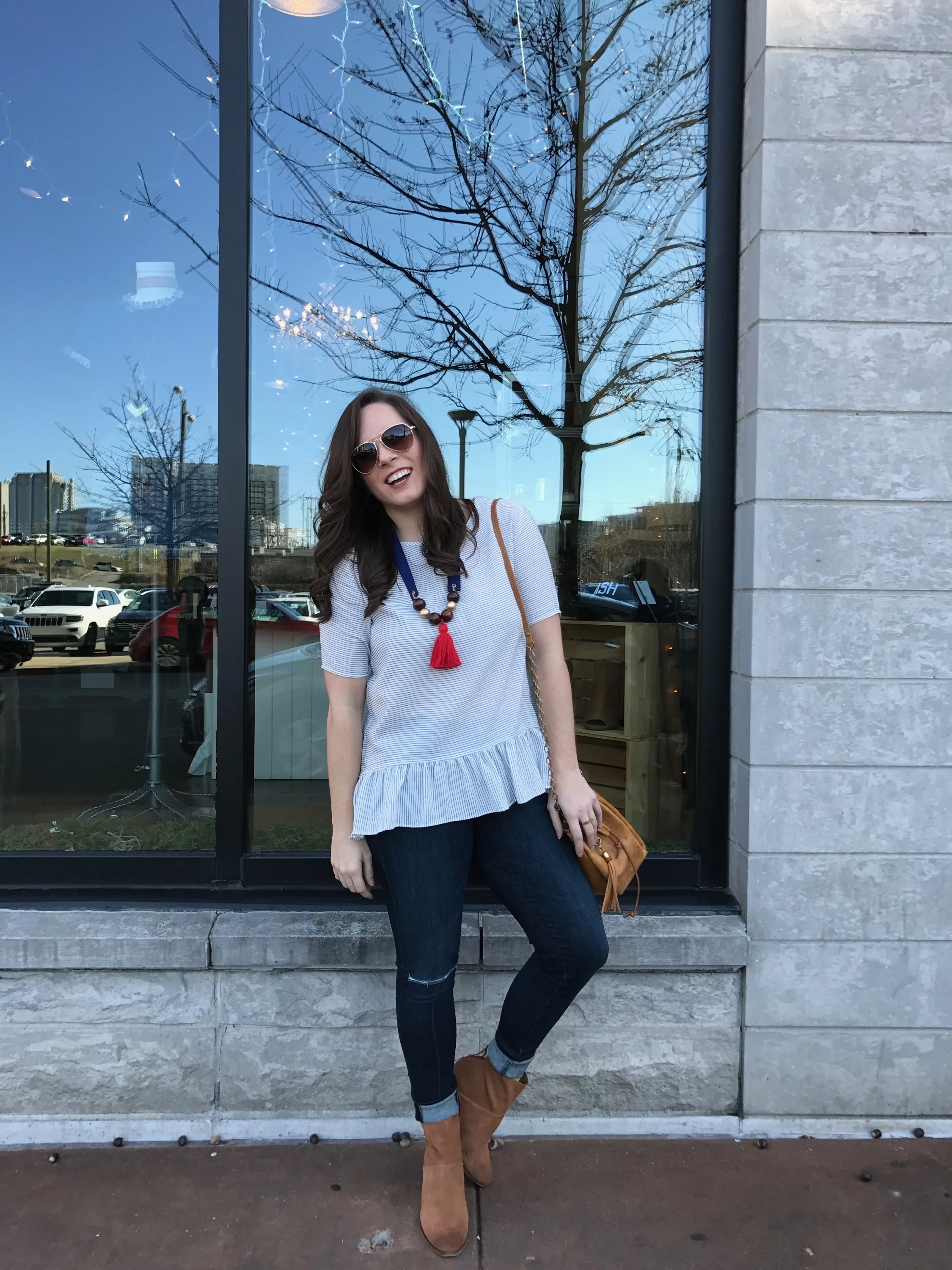 PHOTO: HANNAH STALNAKER Jeans: j.brand | e.Allen Boutique Top: ZOA | e.Allen Boutique Necklace: Hearne Dry Goods | e.Allen Boutique Bag: Canoe | e.Allen Boutique