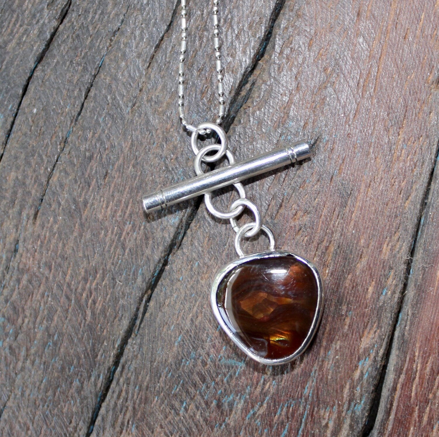 Fire agate in forged sterling silver pendant
