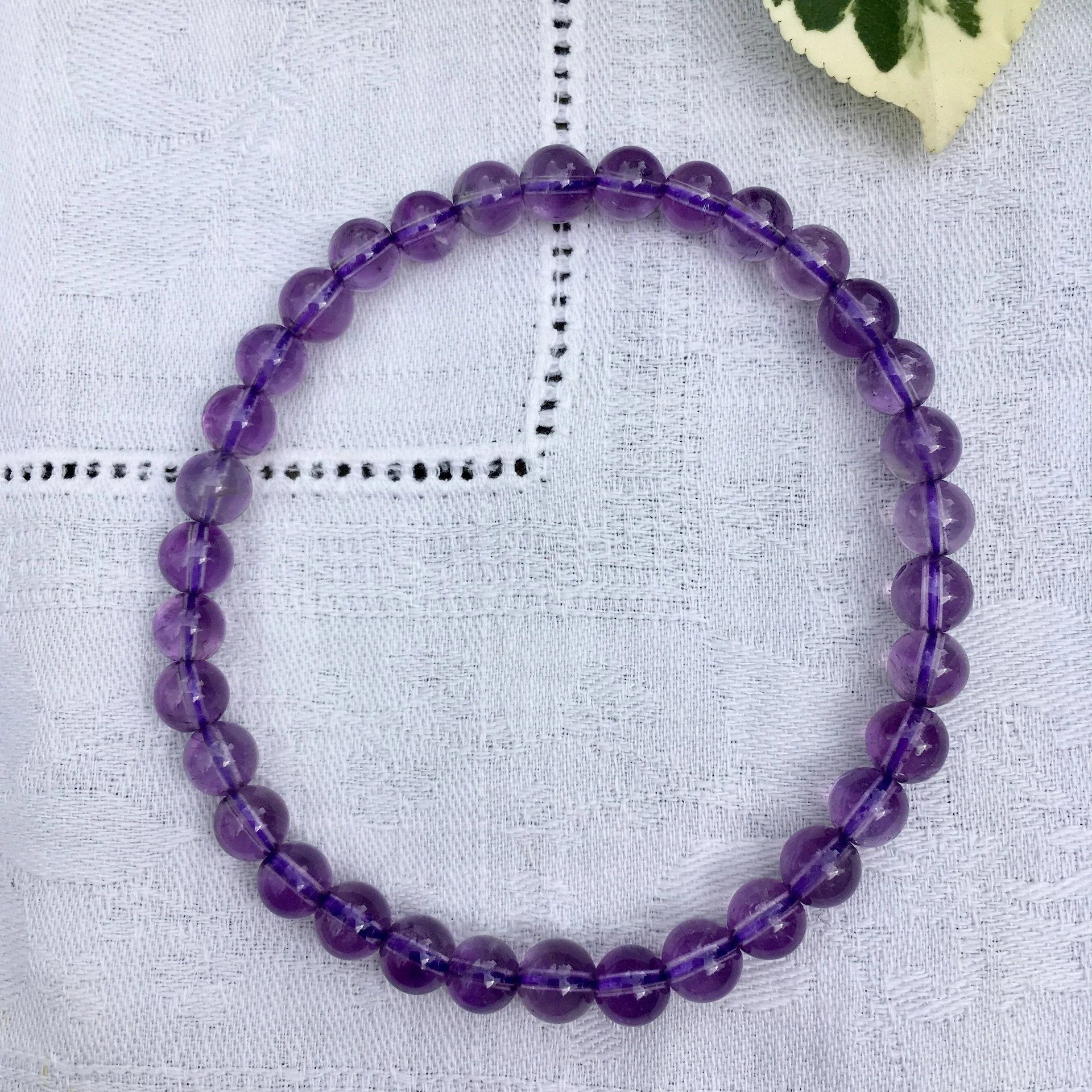 Amethyst bead 6mm pale b.jpeg