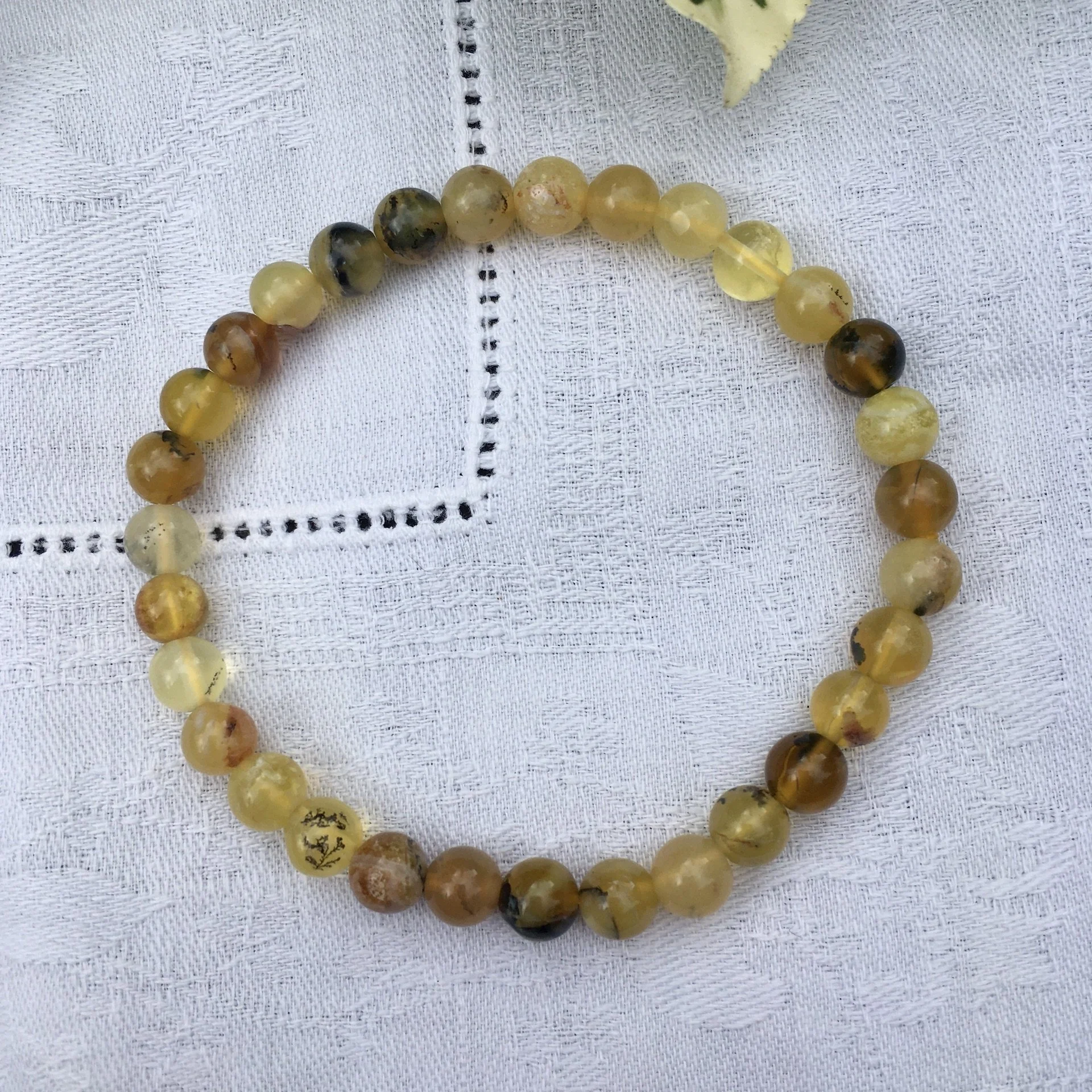 Yellow opal bead 6mm b.jpeg