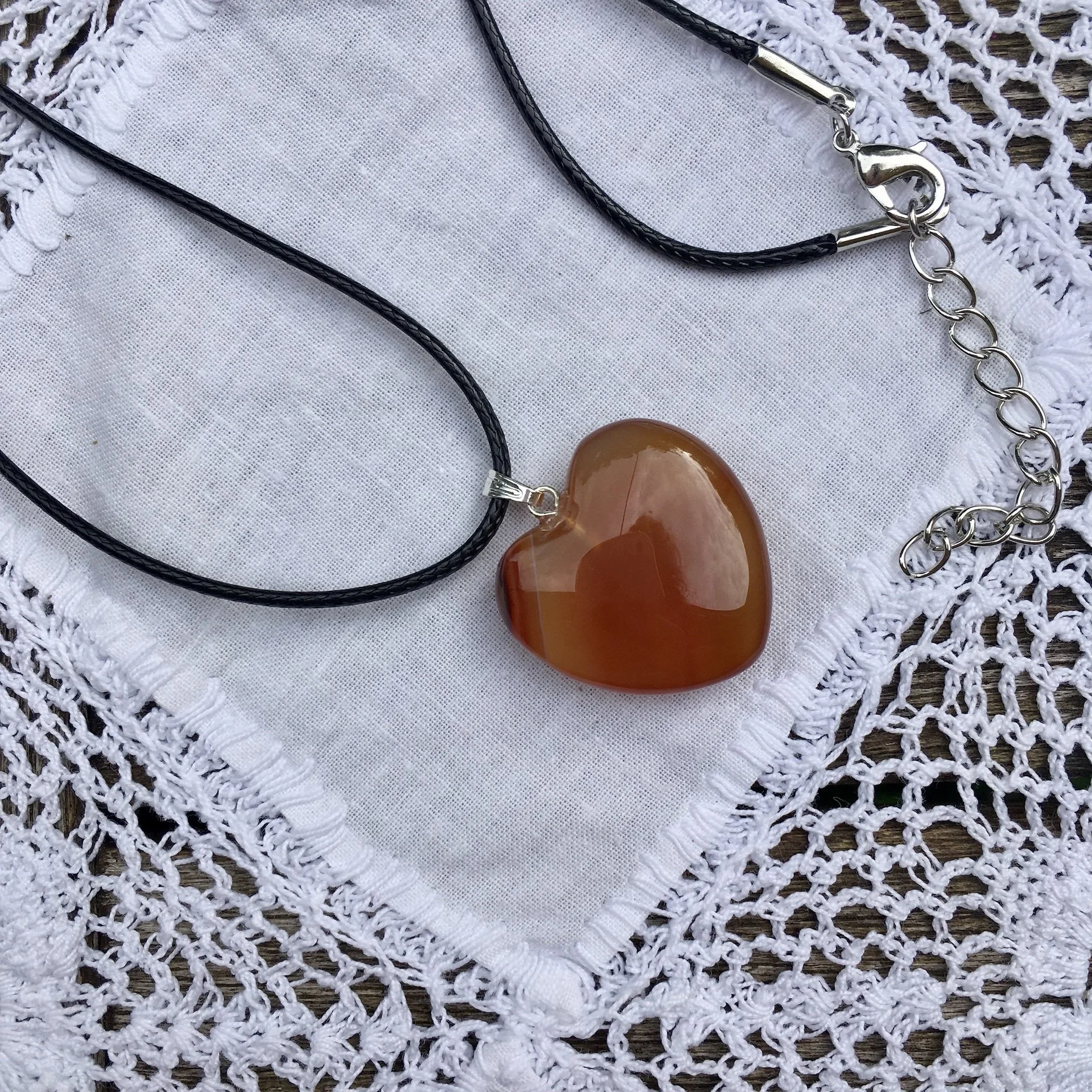 Carnelian heart pendant on cord.jpeg