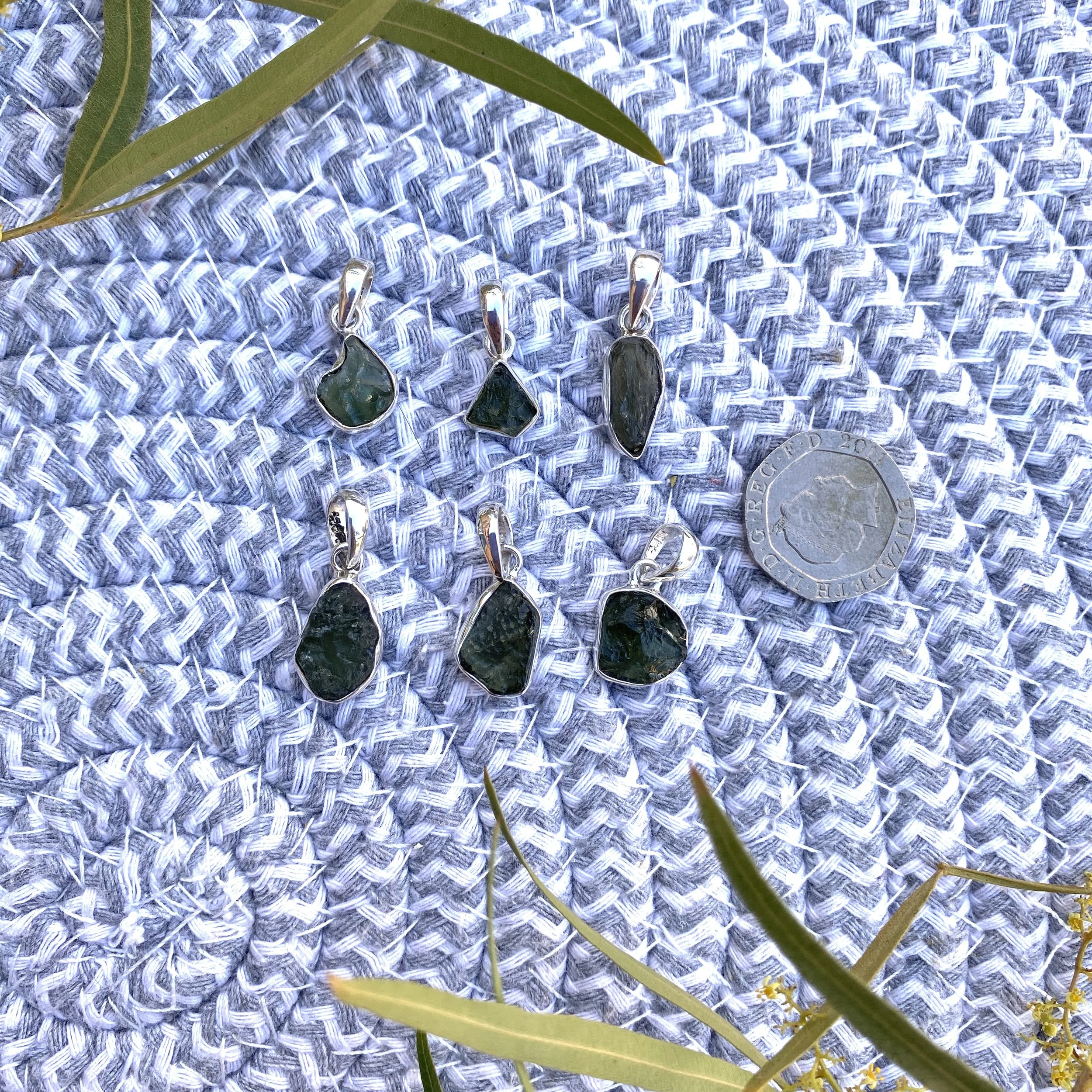 Moldavite pendants Tucson Show2.jpg