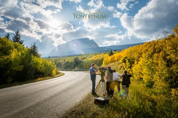 Behind the scenes photograph of "National Parks Adventure" movie crew setting up to film along the going to the sun road in glacier National Park, Montana.
