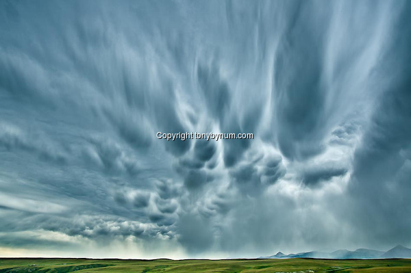 Big Sky's and summer storm along the Rocky Mountain Front, Montana. Montana Photographs (Tony Bynum/tonybynum.com)