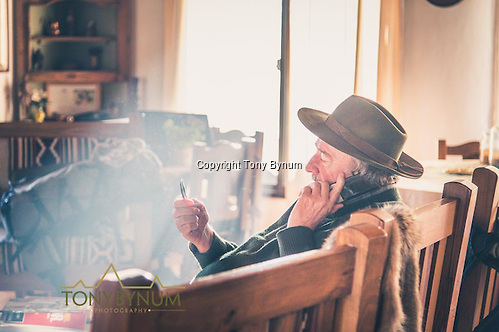 Hunting manager and guide takes a time out to make a phone call. La Pampa, Argentina ©tonybynum.com
