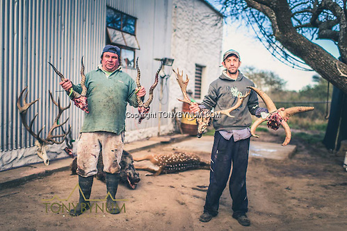 Skinners holding two blackbucks, one four horned ram, and a fallow dear. Los Molles, Ranch. La Pampa, Argentina ©tonybynum.com