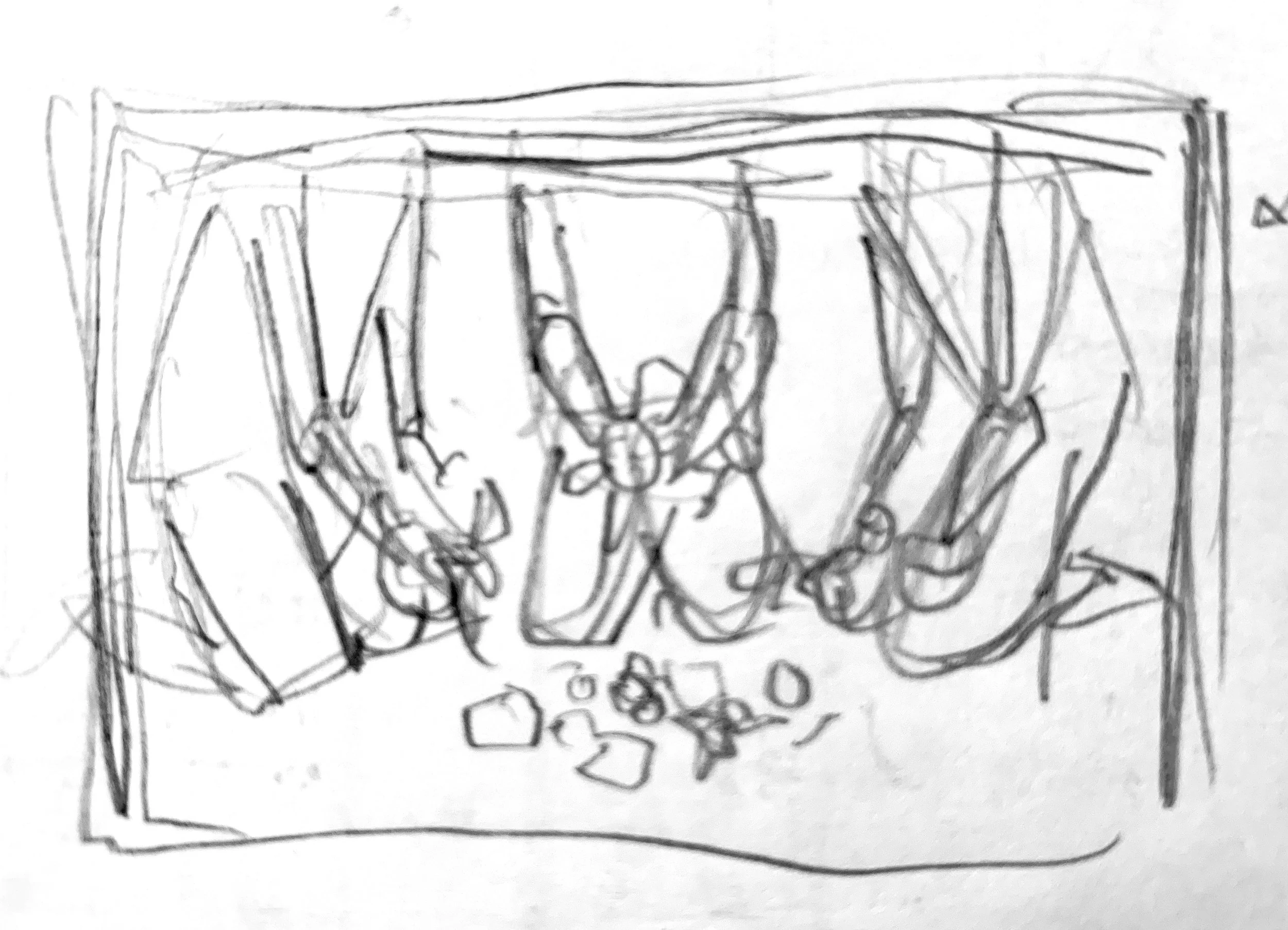   Tight shot composed so that the focus is on the witches’ hands as they pick up various tools and fabric. The three fabric pieces that the doll making material was bundled in is laid on the ground to create a makeshift work area.  NOTE: If necessary