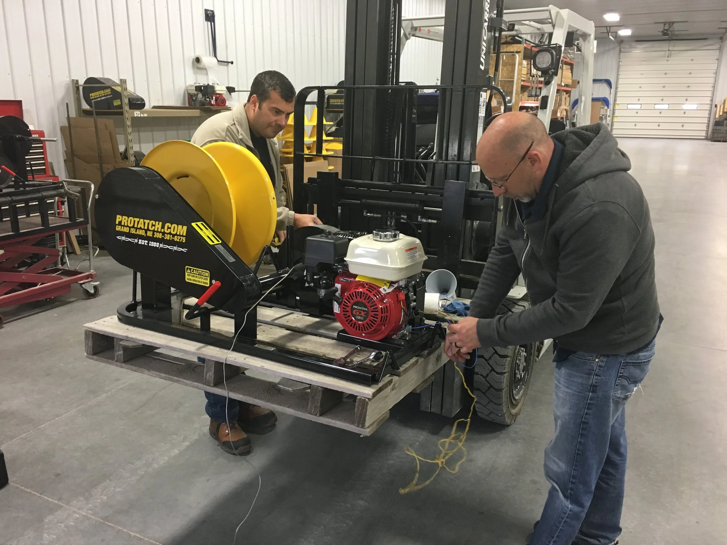 Hotwood's believes in making sure we have picked the right motor or any outside parts it takes to manufacture our products. In the photo above, 2 engineers from Honda Motor Corporation, test the Honda motor we use on the Gas Powered Winder, for vibration, temperature control during operation, power output, and general performance, to be 100% positive we are using the right motor for our application. After almost 1 hour of extensive testing under load and in idling mode, The Honda specialists were very pleased, and were 100% sure we were manufacturing, not only a terrific product, but using the right components to assure the customer years of satisfaction. This is one of the reason's Hotwoods is number 1 on the market with all our wire winders we manufacture, under the Pro-Tatch Inc. name, and have been for over 32 years. We want you, the customer to be happy with the performance of this unit, or any product you purchase from us. If it will not work for the customer, how is it ever going to work for us?
