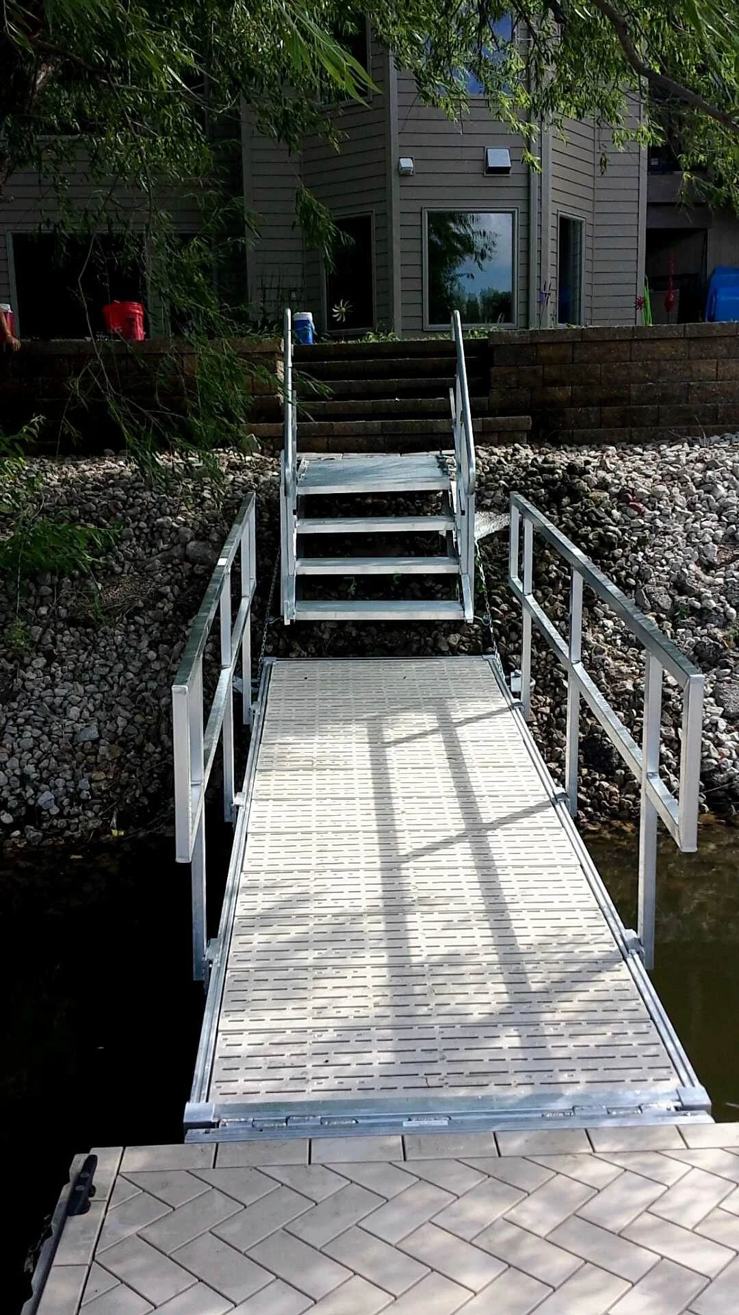 Anywhere stairs installed by Hotwood’s to get down this slope to the walk way and the dock safely.