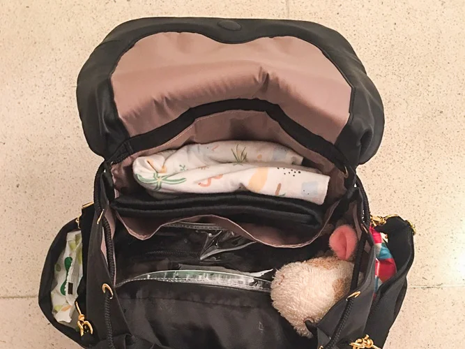 You can see how the CoziGo fits well into Bronwyn's backpack Photo Credit: Bronwyn.