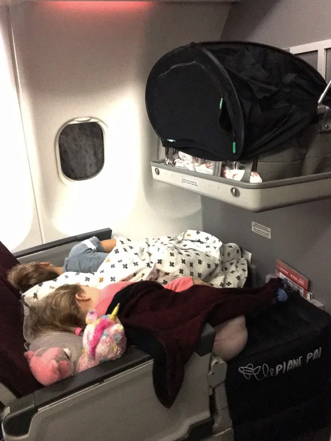 Three kids fast asleep! Now looks like a relaxing flight. Photo Credit: Bronwyn.