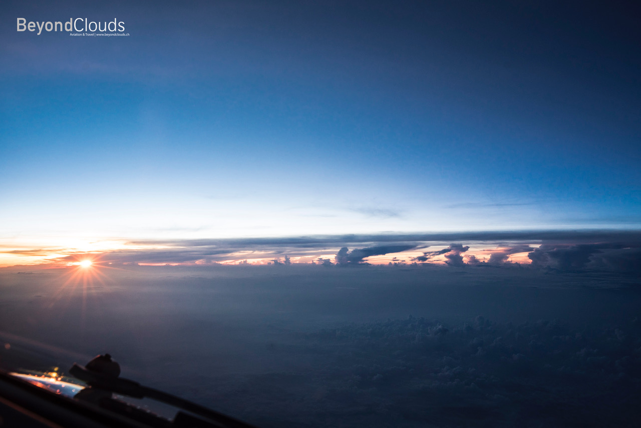 We are just reaching the airspace of Myanmar as the sun slowly peeks above the horizon. A beautiful sight with impressive thunderstorms along the horizon.