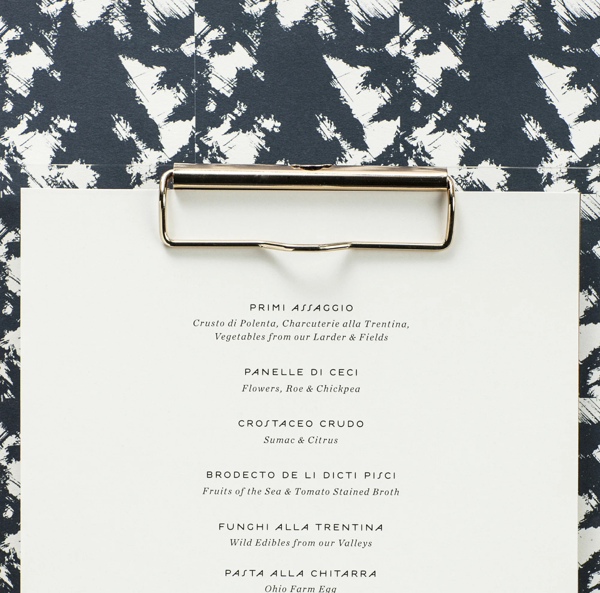 Menu design and branding for Chef Jonathan Sawyer's restaurant Trentina by the studio of Christine Wisnieski. 