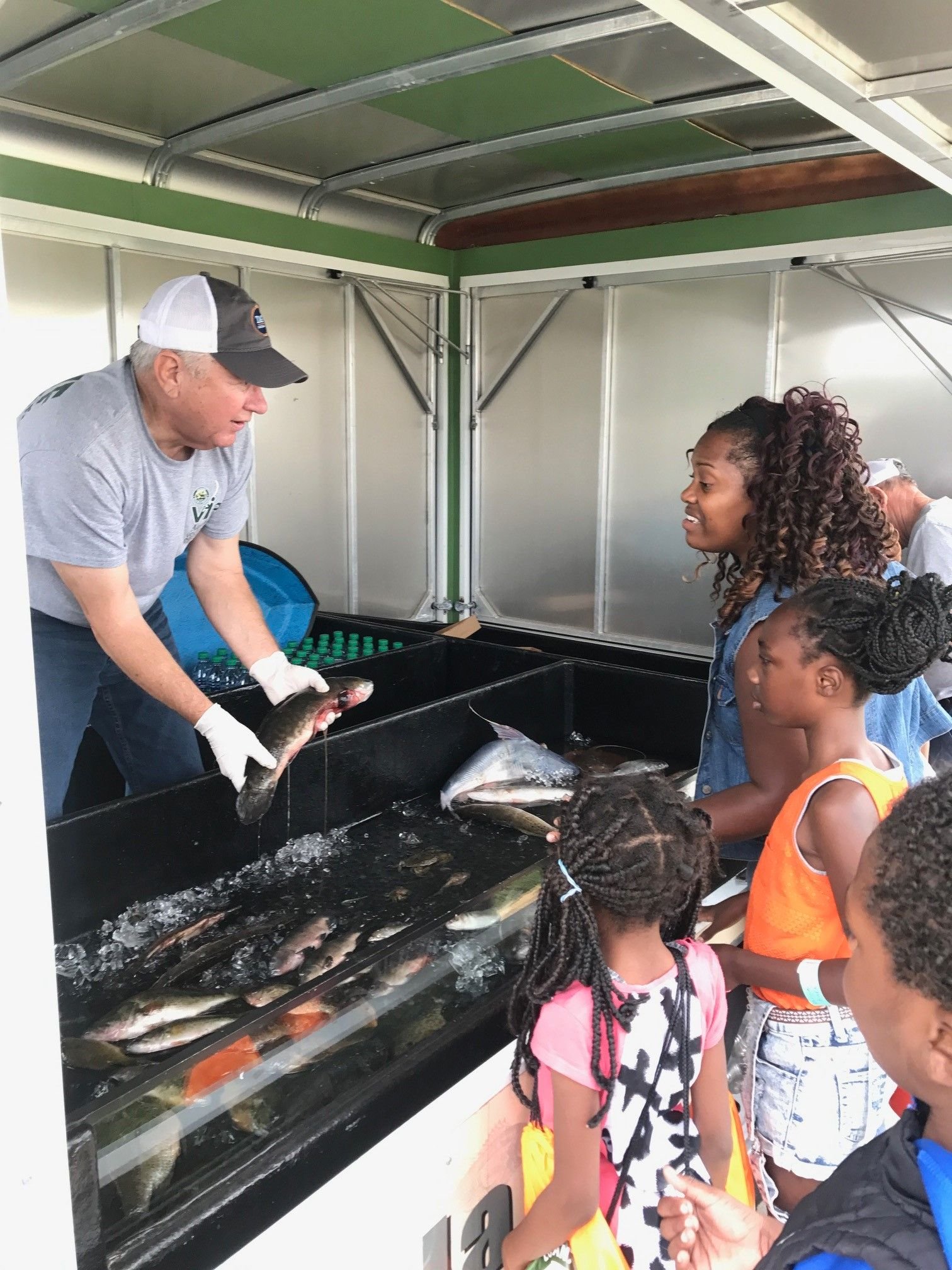 VIP showing fish to kids.jpeg