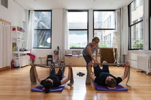 Belinda takes two actors through Alexander Technique floor exercises to learn about support with fabric straps.