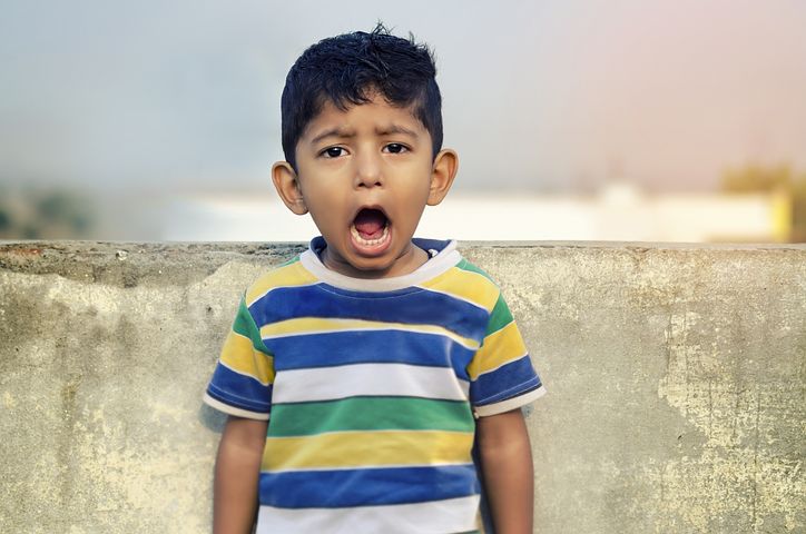 A little boy opens his mouth wide to express himself. Actors can learn a lot through his unabashed expression and lack of physical holding.