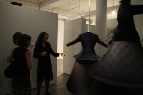 Wherein Fury Takes Flight...Pou (right) with viewers at opening reception