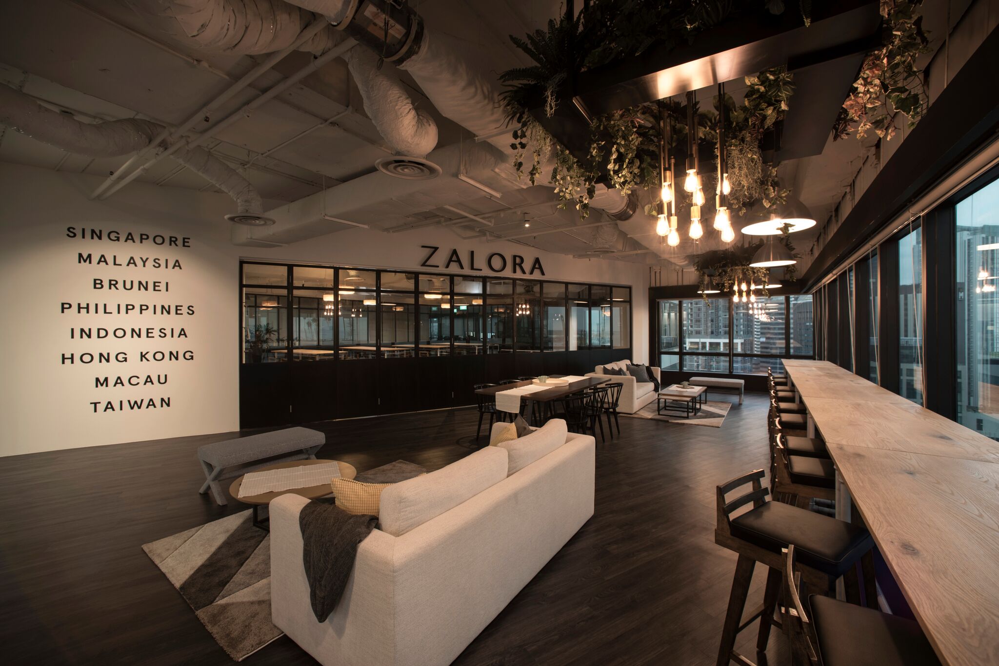 We were fortunate to be able to work closely with Art.Komorebi, a talented interior design firm to come up with a botanical styling concept for ZALORA Singapore at Keppel Tower. The design brief required us to design their office cafeteria - where working staffs can chill and work in a relax, cultivating environment. Working closely with our corporate client and creatives from the design industry brought about various challenging ideas. We wanted to create an evocative setting, a focal area where people could experience the richness of the space within the geometry. The plant feature on mild steel were designed and position to cast a parallel line alongside the folding doors to create an internal configuration of a space to be customised for different purposes. 