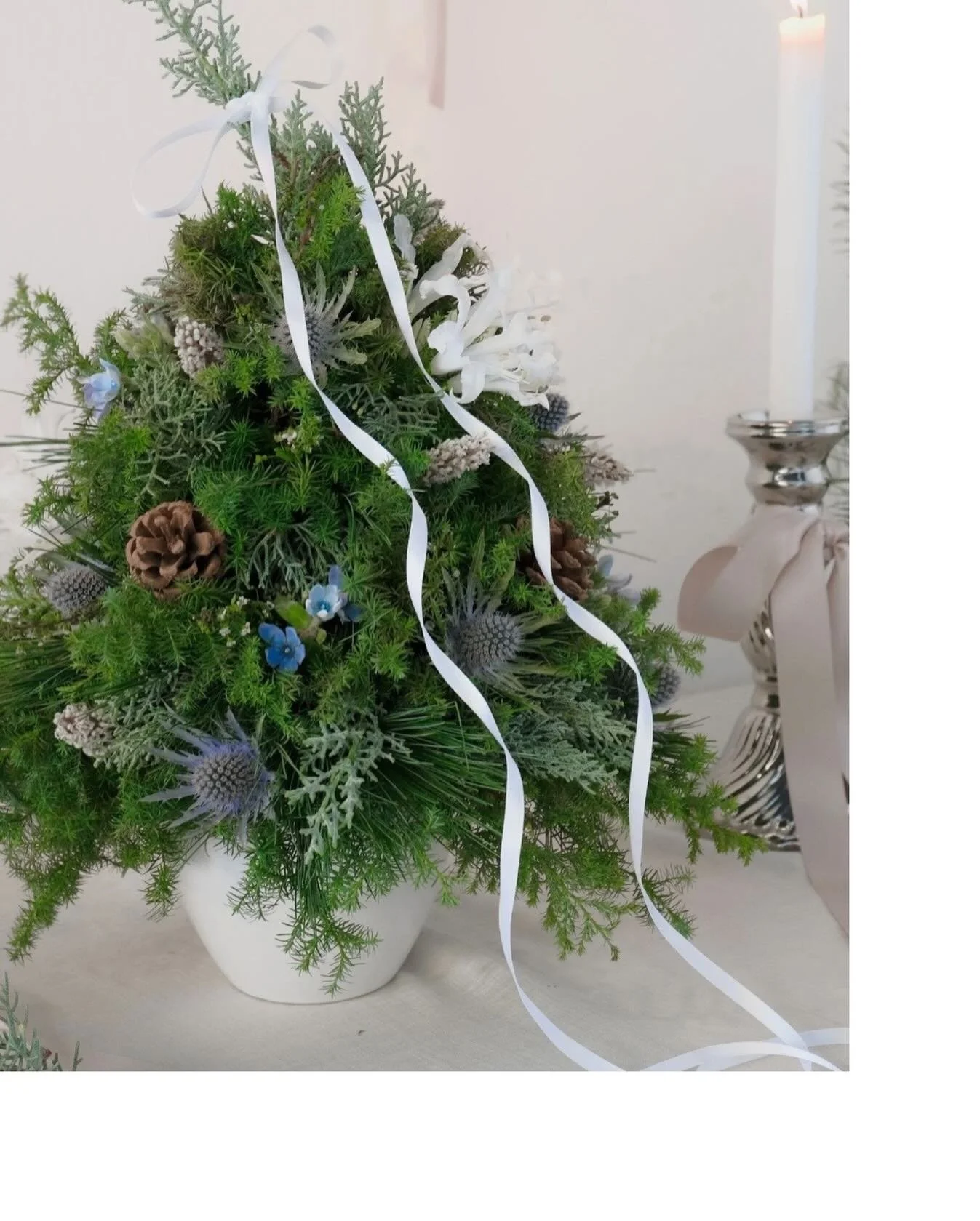 White Christmas 2025 // Moonlit Yule

Whites, silvers, and icy blues shaped into a floral tree that catches the light like winter moonshine. A subtle, dreamlike way to welcome the season.

Ethereal, serene, and softly festive - Embrace the season&rsq