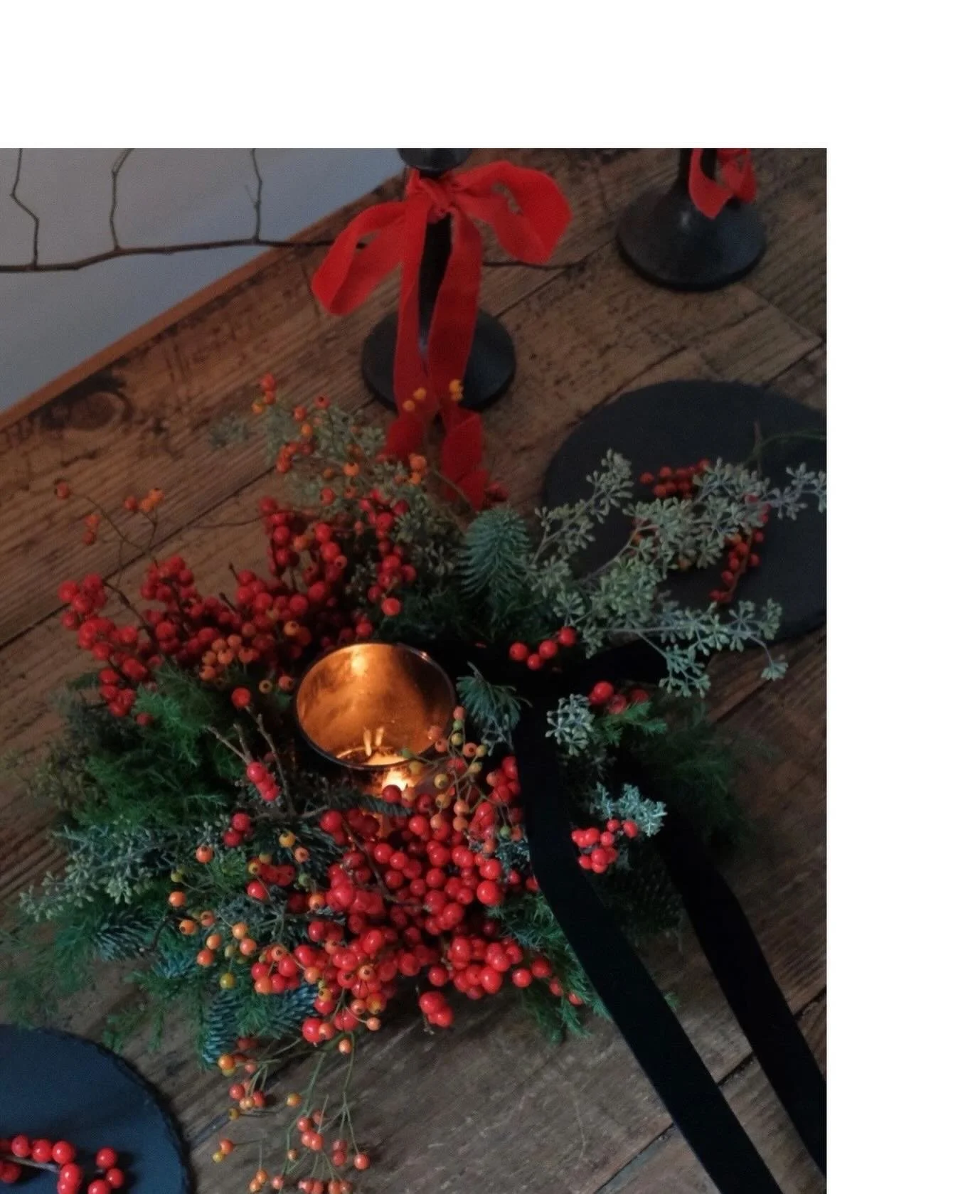 Velvet Tidings - Christmas 2025// Fireplace and Fairylights

A cluster of red ilex berries, layered with quiet depth and gentle movement &mdash; a wreath that warms the room the moment it enters

A quiet statement piece that reminds of flickering war