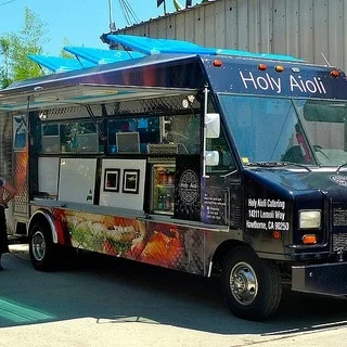 Holy Aioli10a-8pThe ultimate food truck for divine sandwiches &amp; salads. We offer unique filings and aiolis that turn sandwiches and paninis on their heads.&nbsp;Holy Aioli carries Thumann's meat products, made from the finest ingredients, all na…