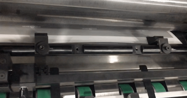 Slow motion of the gripper finger system housed in the lower cylinder of all Insignia machines grabbing the leading edge of each sheet as it is pulled through the cutting station. This allows for maximum control of the material as it is being die cut. 