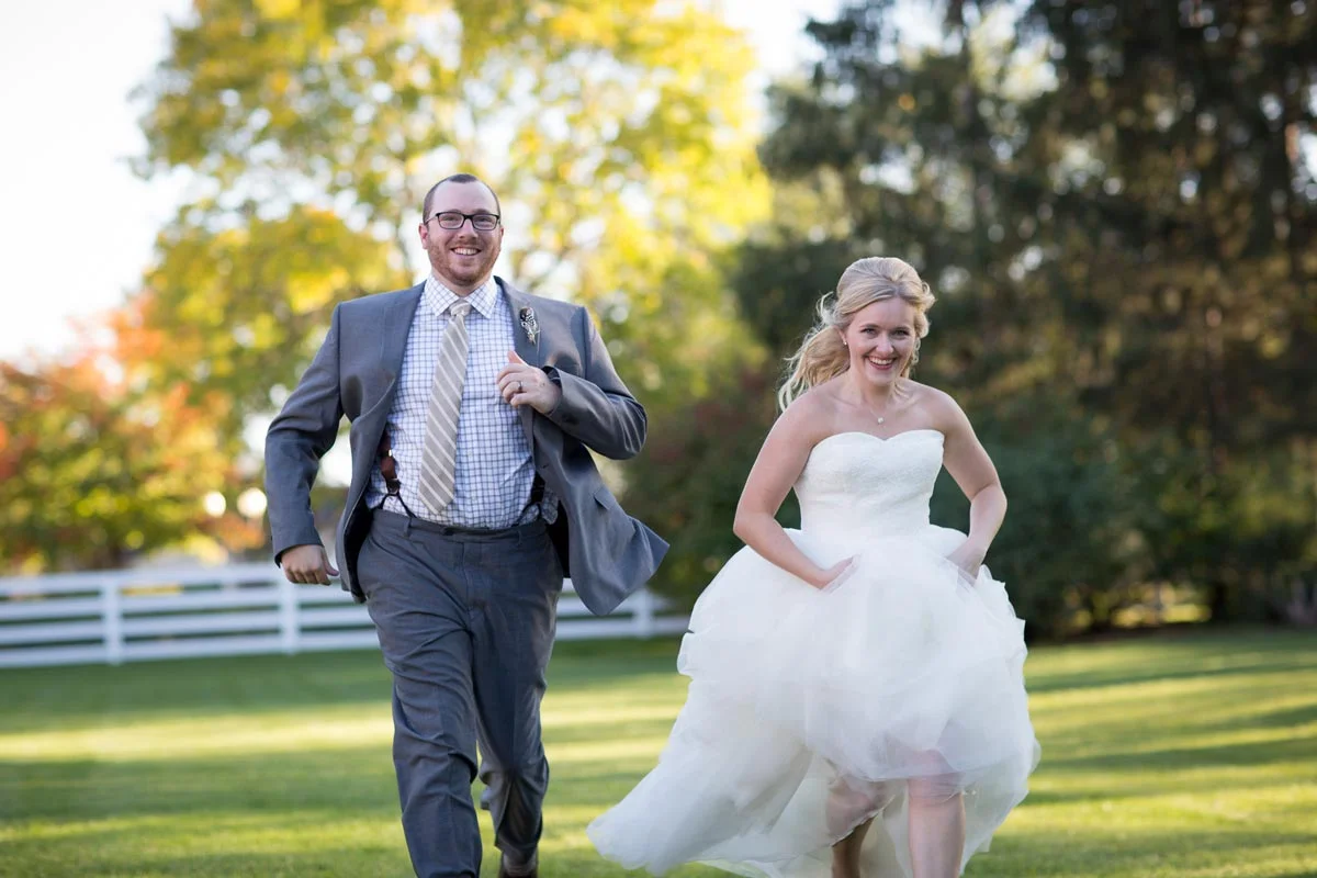 Excited Running Couple fun bride groom portrait golden hour Earle Brown heritage Center minnesota husband wife photography team minneapolis st paul twin cities wedding photographer
