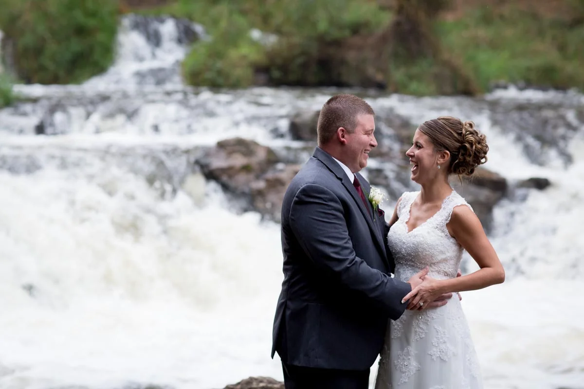 Bride Groom epic Waterfall Portrait Fun Willow River State Park hudson wisconsin lace bridal gown minnesota husband wife photography team minneapolis st paul twin cities wedding photographer