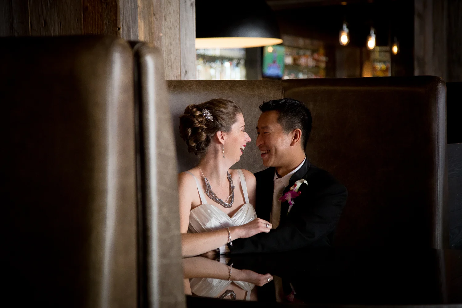 minnesota husband wife photography team minneapolis st paul twin cities wedding photographer radisson blu weddings mall of amerai bride groom low light portrait quiet moment happiness
