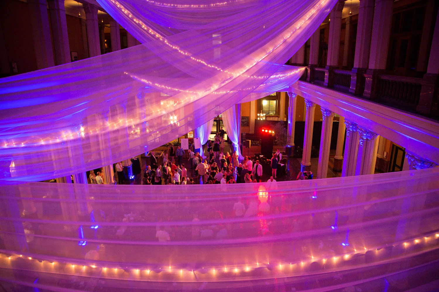 29-the-landmark-center-st-paul-mn-wedding-photographer-reception-fun-dance-dancing-linens-drapery-twinkle-lights-pink-uplighting-mahonen-photography.jpg
