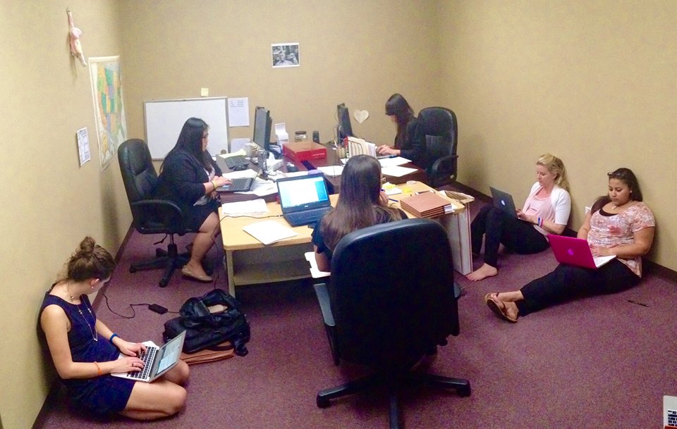 Working on asylum applications and country conditions reports at Raices after a long day at Karnes