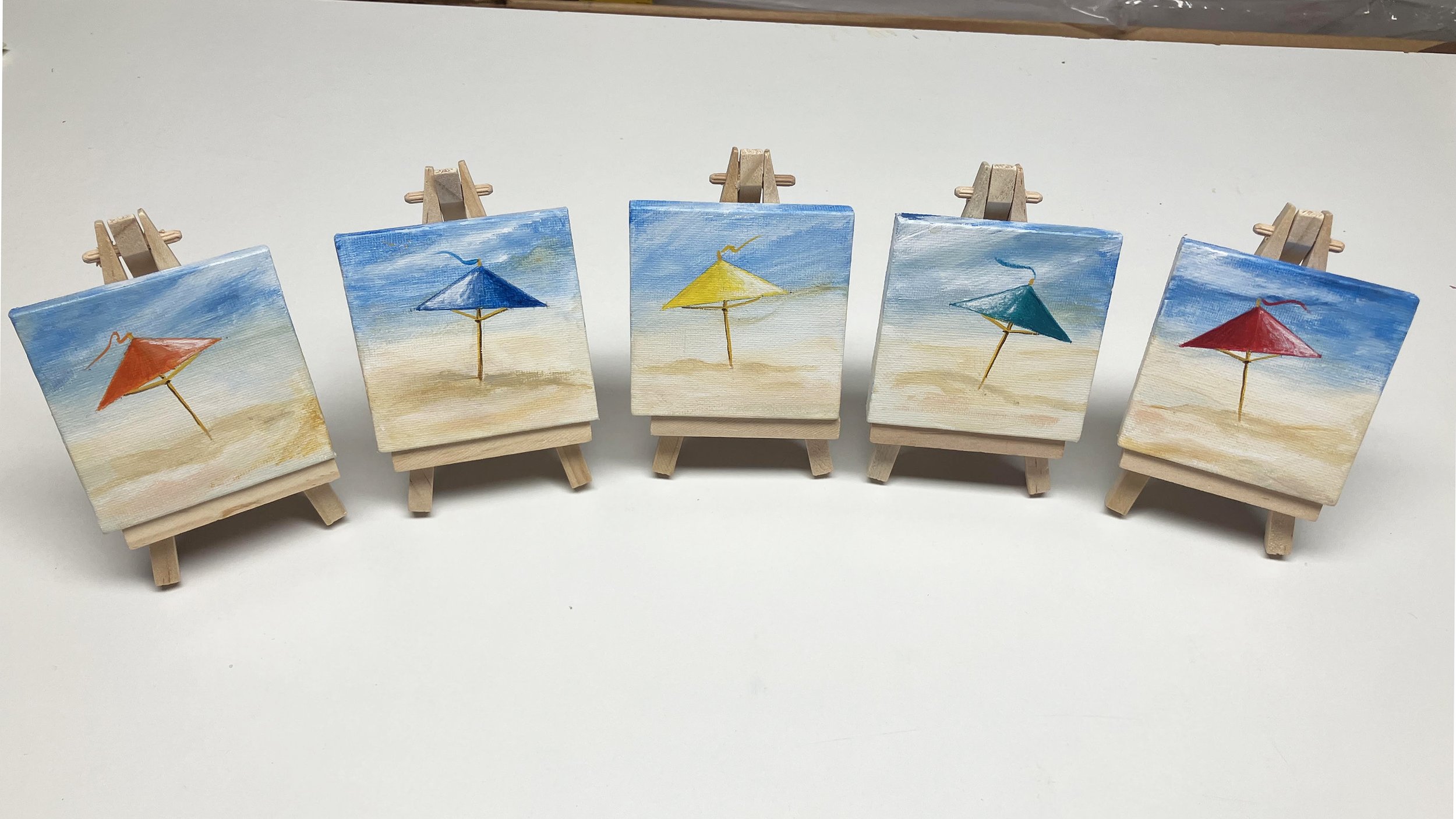  New series of  “ Beach Umbrellas “.    Inventory is always changing.  If the Umbrella color you like has been sold, I am Happy to create one for you.   Umbrellas are 3” X 3” on an easel.  ‍  ‍ $40.00 plus shipping and handling.   