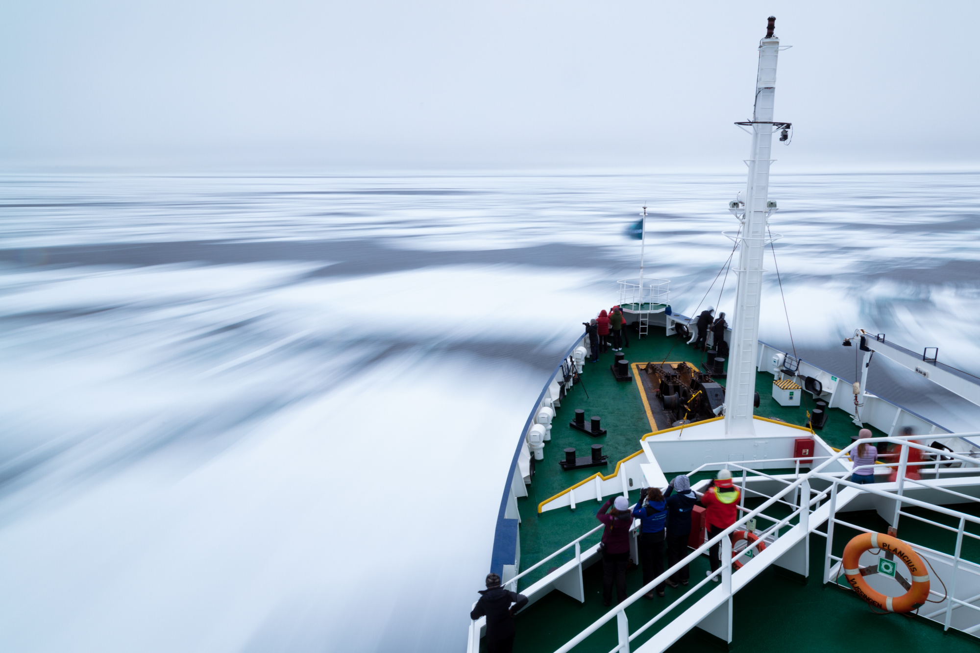 The M/V Plancius journeys northward on the frozen seas of the Arctic Ocean just 500 miles from the North Pole during my expedition to Svalbard. Sailing along the northerly archipelago and onto the frozen ocean alongside 4 of my photographic idols, Daisy Gilardini, Michael Melford, Chris Linder, and Justin Black was an experience beyond what I could have ever dreamed. Standing beneath rumbling glaciers and towering mountains, watching the midnight sun peek beneath golden clouds, and encountering polar bears on the frozen sea defies all explanation. The aura of nature's raw power and beauty is palpable on the roof of our living planet.
