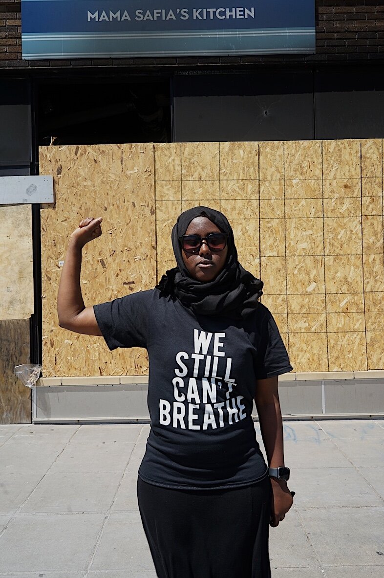  “June, 2020 - Minneapolis, Minnesota - Saida Hassan is a Somalian born educator standing in front of her mother’s restaurant that was burned down during the protests over George Floyd’s death. Her mother recently opened the restaurant in 2018 with h