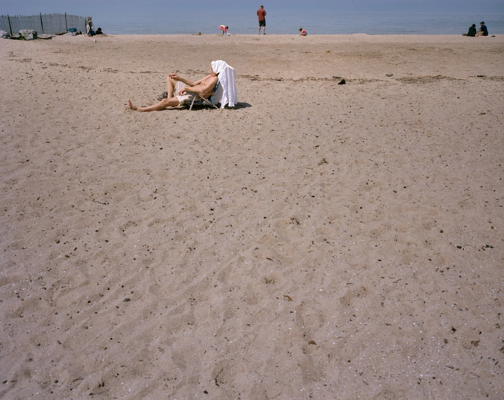 2026-05-IrondequoitBayPier-SleepingMan.jpg