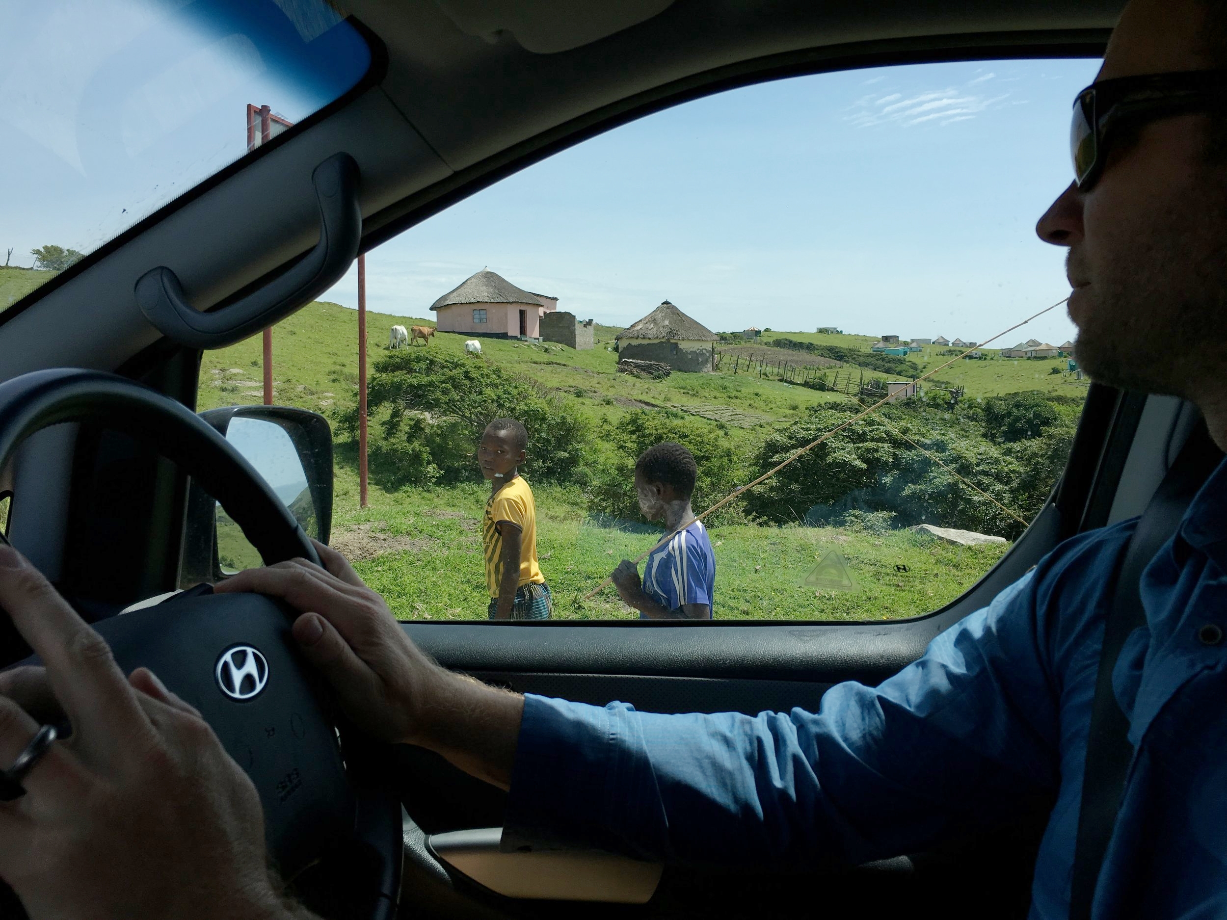 Boys with fishing poles along the Wild Coast of South Africa.