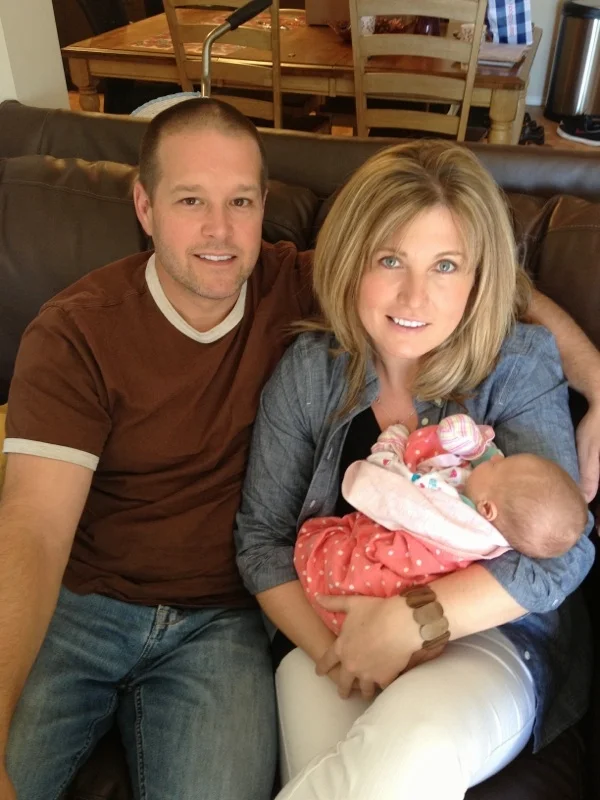 (My Dad and Mom holding Olive when she was only a week old.)