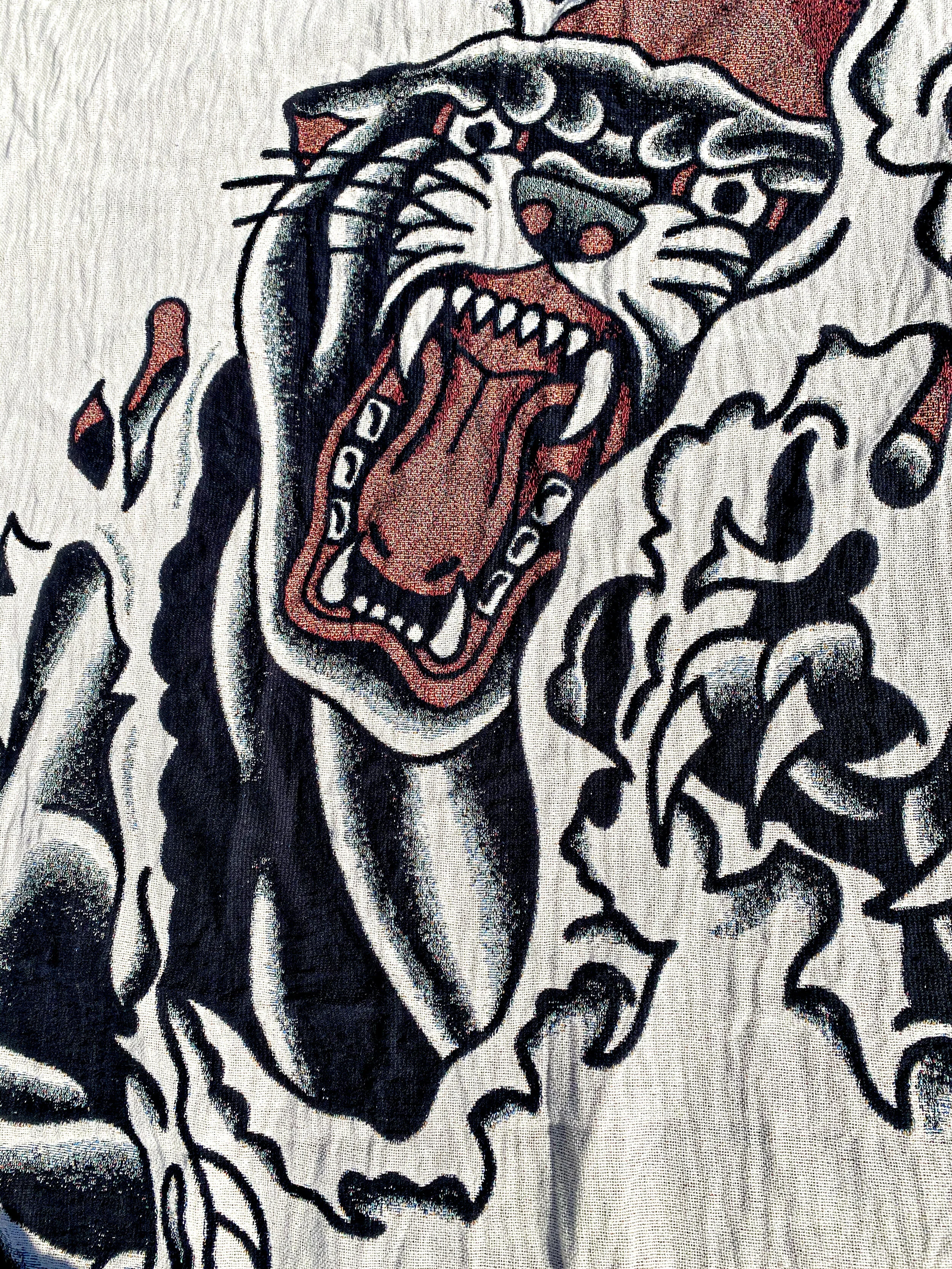 panther-tear-rip-tattoo