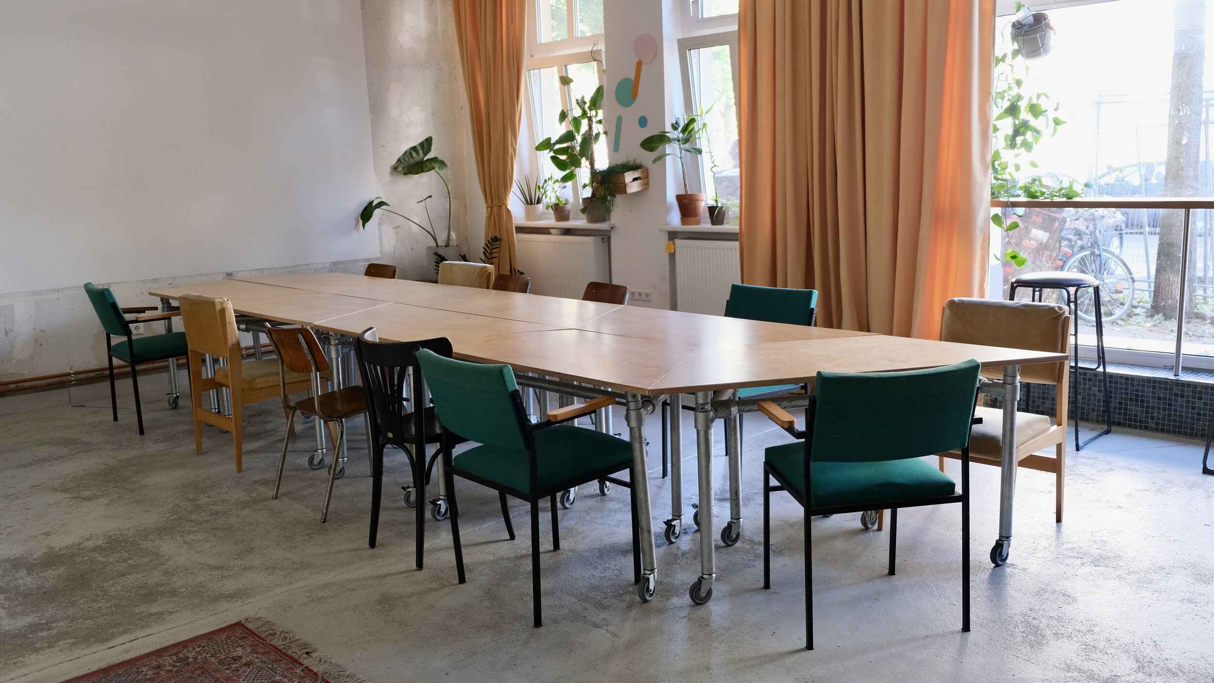 separate tables forming a long table in event space´s front room 