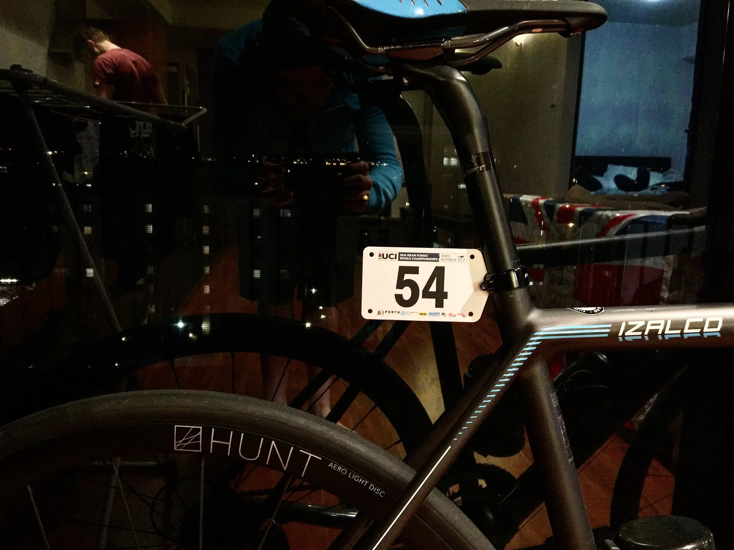 Race numbers pinned to the bike and the kit.