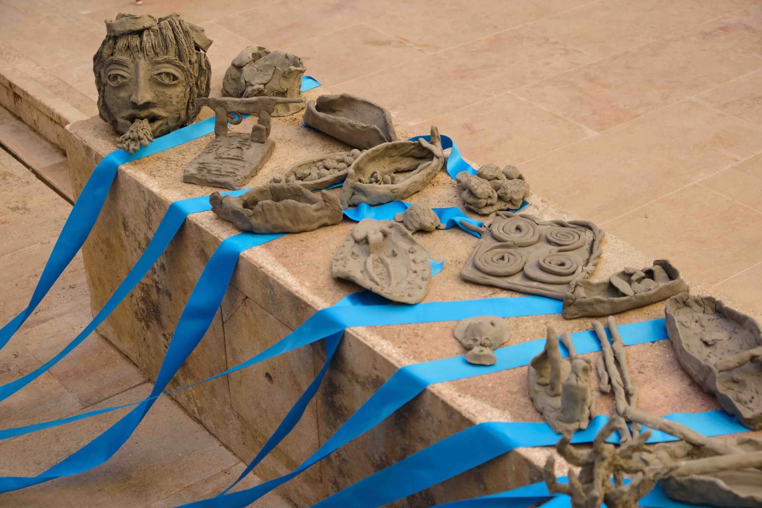  Some of the community outreach works (detail).    Grotto Girl  was the culmination of my four-week creative residency at MUŻA, during which I worked closely with a range of local communities to explore themes of identity, memory, and belonging. I br