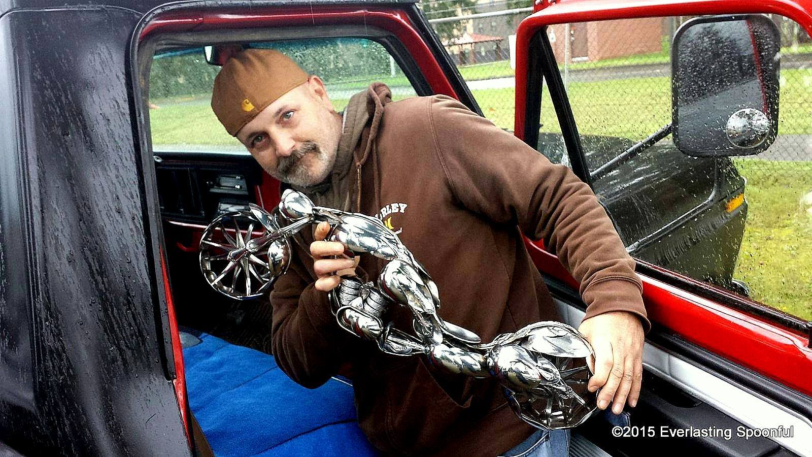 Artist James Rice, with his spoon motorcycle sculpture "The Wasp"