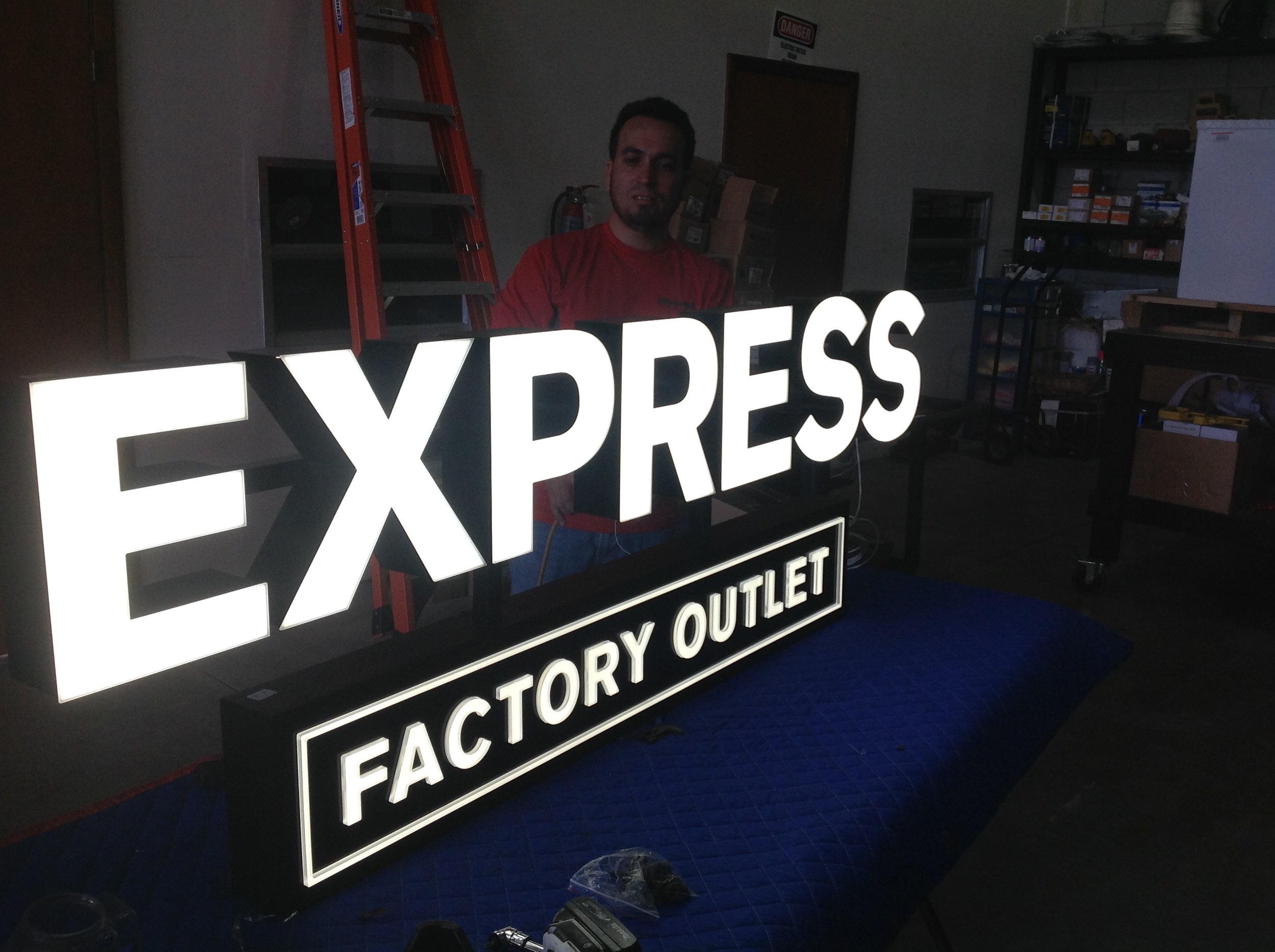 sign installation - express factory outlet.JPG