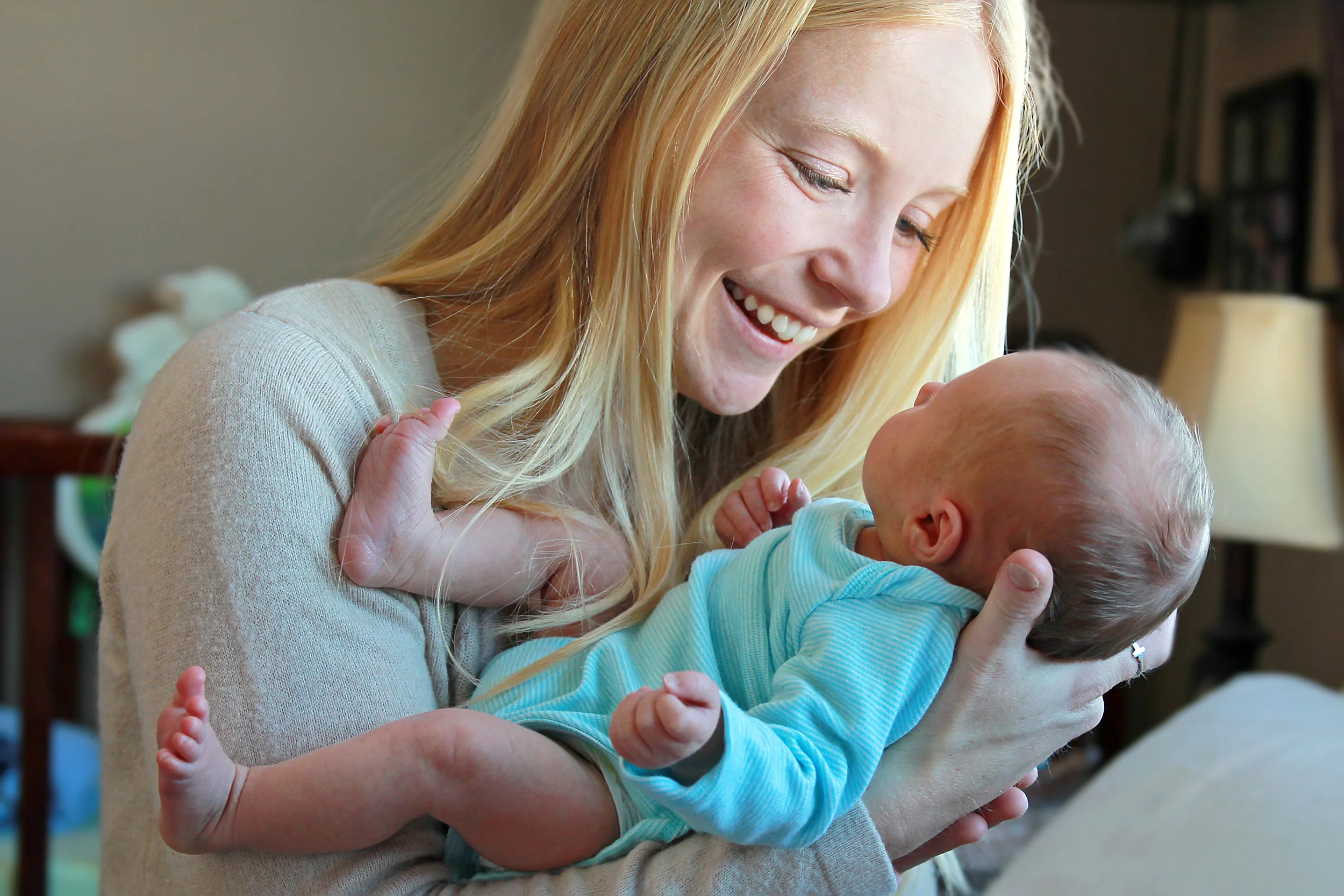 photodune-10909611-young-mother-smiling-at-newborn-baby-in-home-nursery-l.jpg