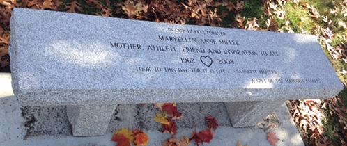Bench located at the gazebo on the Holliston Rail Trail Given by the Marcoux Family