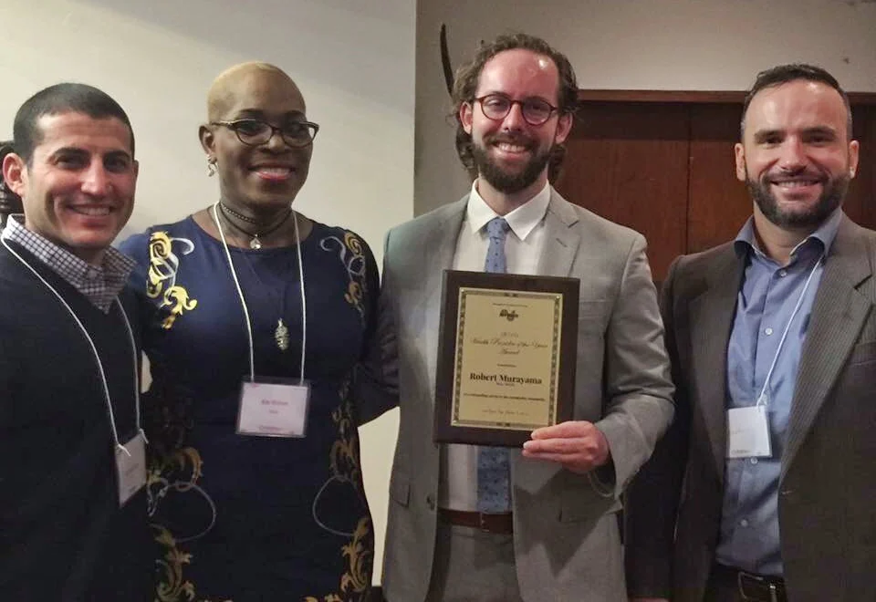 Ms. Kim Watson, Board Member of Project AFFIRM, presents the 2016 Health Provider of the Year Award to Dr. Murayama. Phil Miner, Director of Grants and Communications at APICHA, accepted the award.