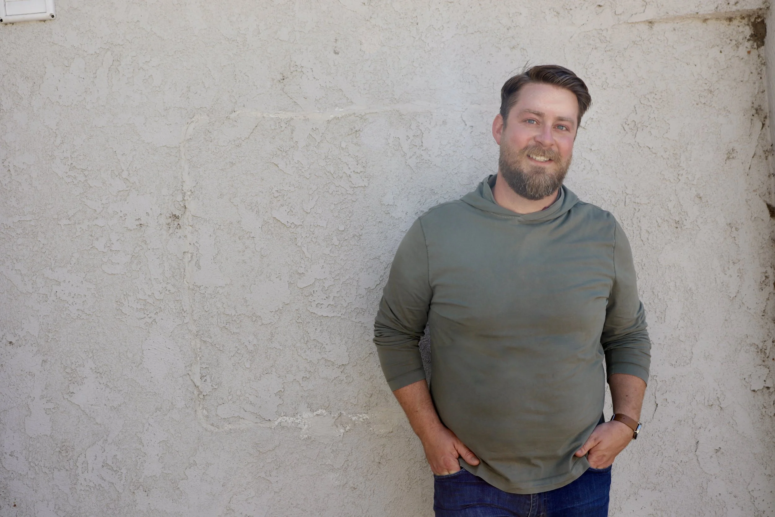 Scott Treas, ADHD executive function and career coach, standing against a white wall