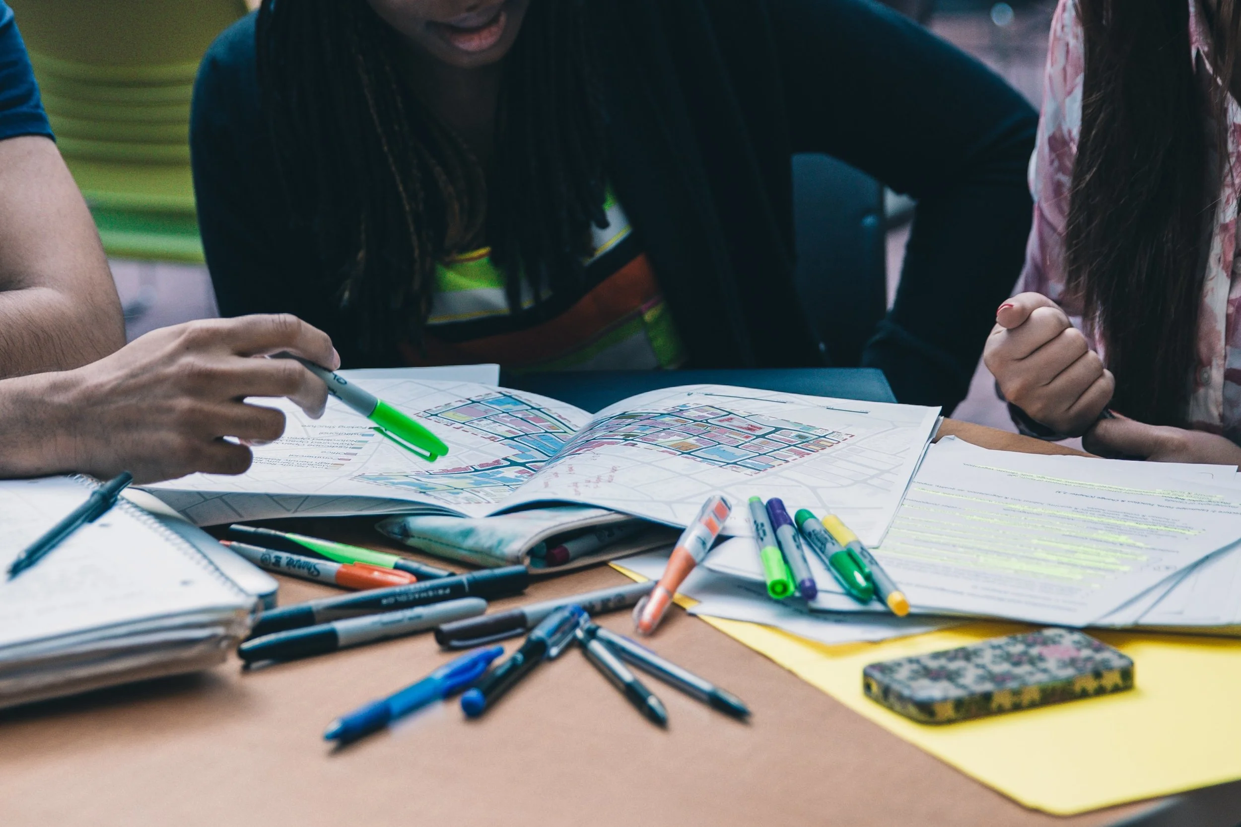 A group of students studying showing how a study skills coach can help students.