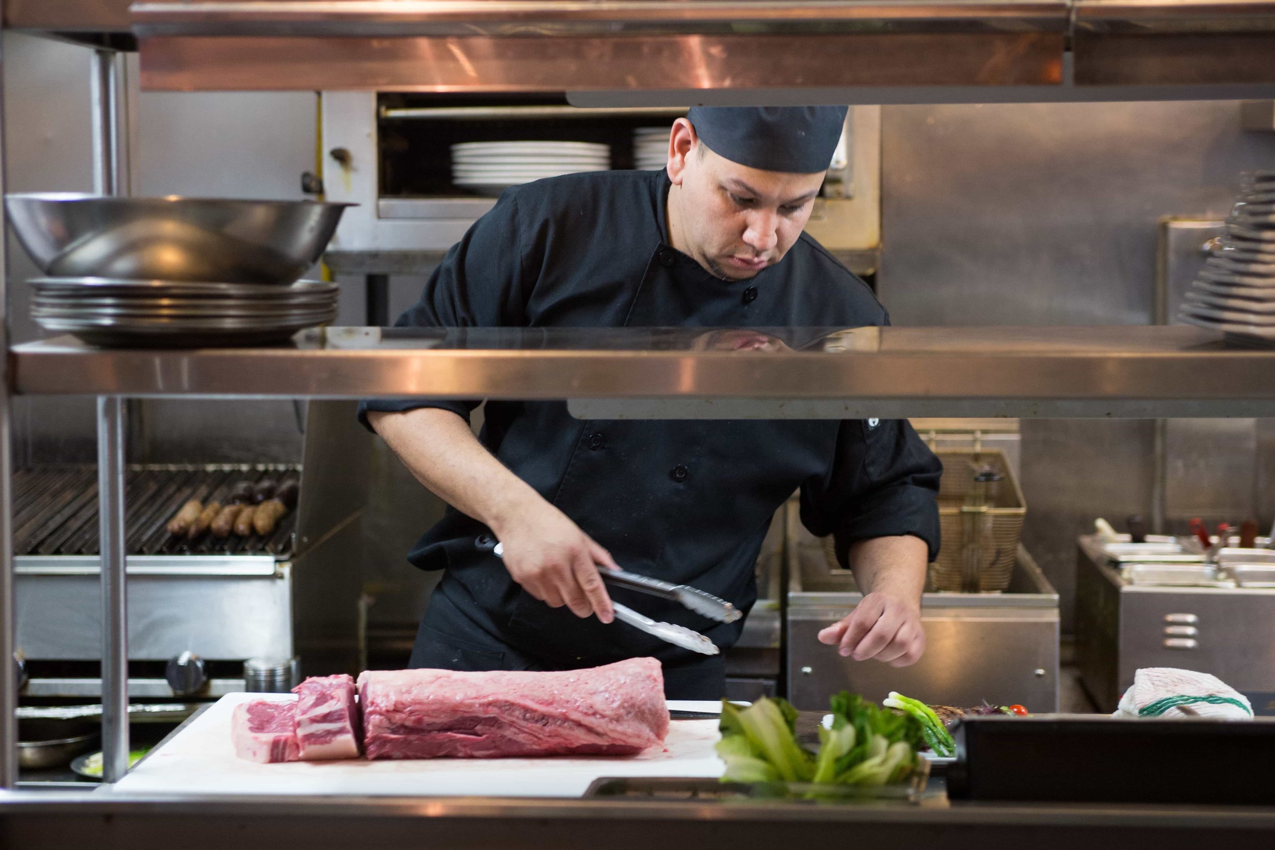 puerto-la-boca-chef-cutting-meat.jpg