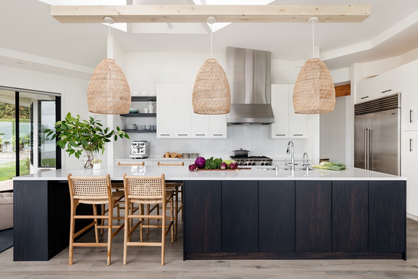 Every remodel presents its own unique challenges, it's what makes them interesting! One of the primary challenges at the #camanobeachhouse was figuring out a way to bring lighting down to the kitchen island without blocking the existing large skyligh